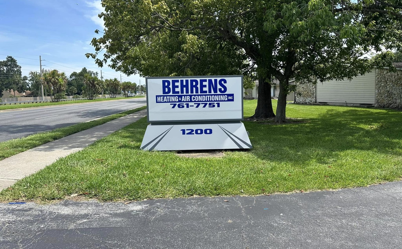 Monument sign for Behrens Heating & Air Conditioning in Daytona Beach, FL, with an illuminated cabinet and address base